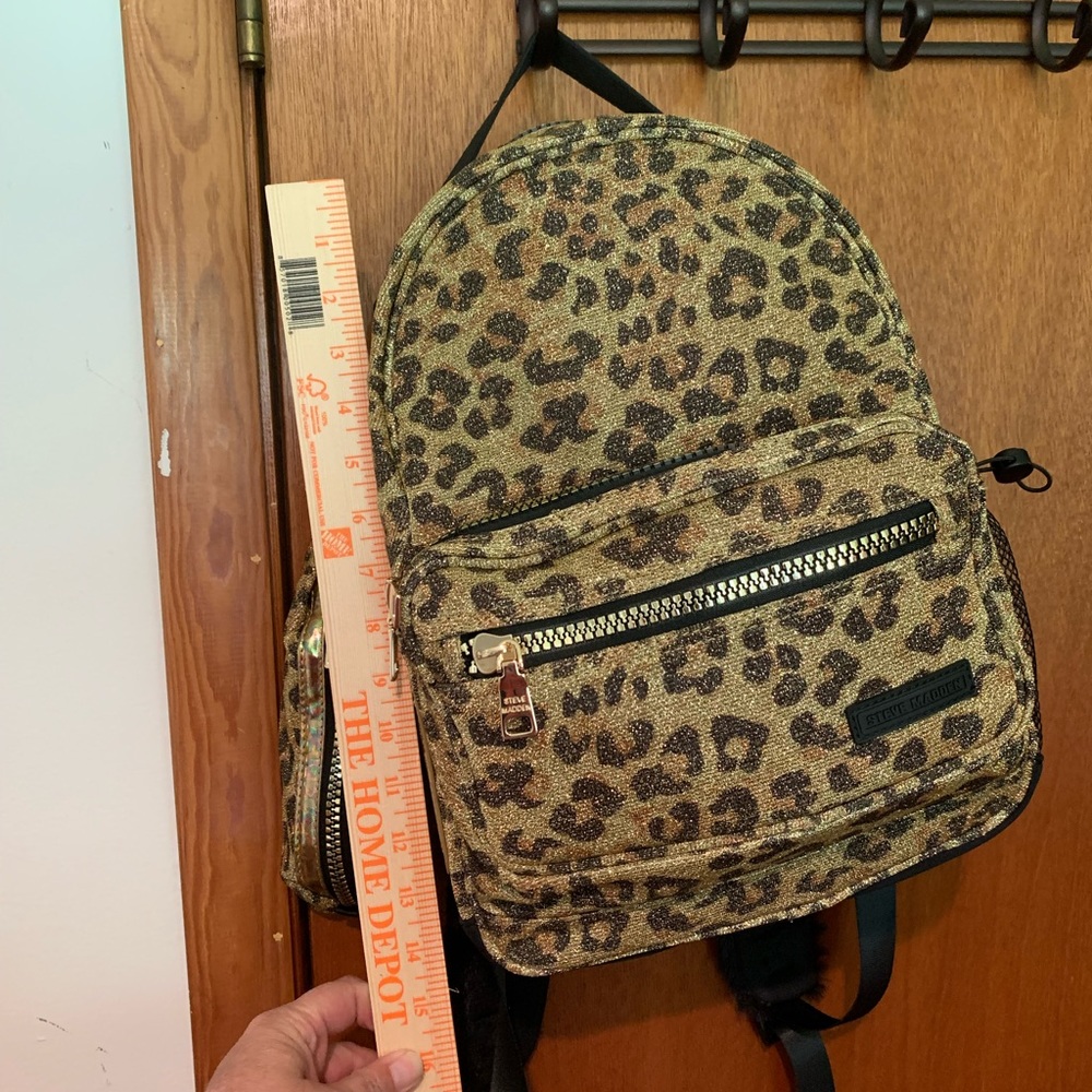 Steve Madden New leopard print back pack with pencil holder! Sunglasses?